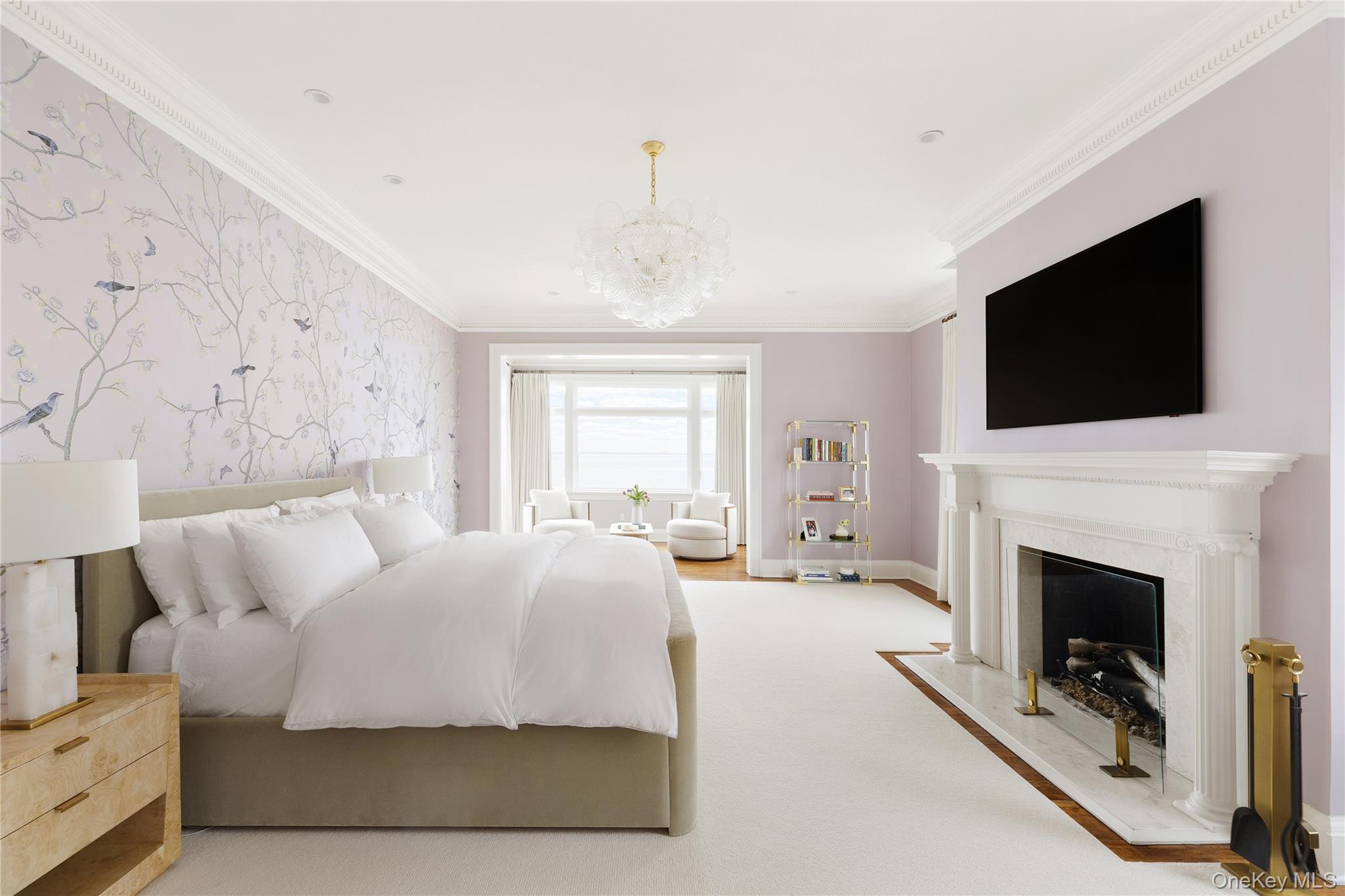 217 Hommocks Road Larchmont, NY 10538 - Photo 15 of 49 a bedroom with a bed and a fireplace