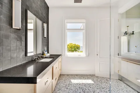 a kitchen with a sink stove and cabinets