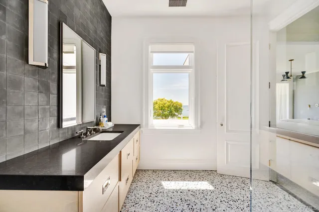 a kitchen with a sink stove and cabinets