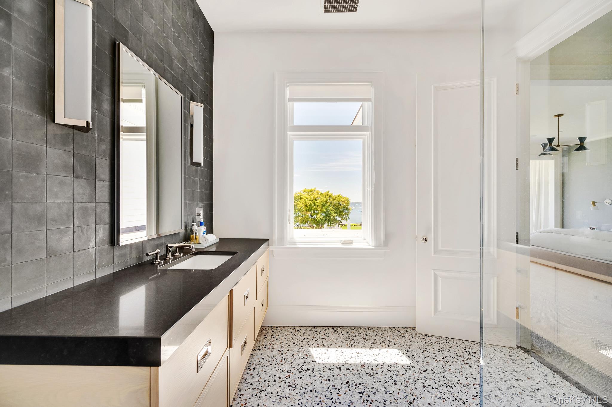 217 Hommocks Road Larchmont, NY 10538 - Photo 21 of 49 a kitchen with a sink stove and cabinets