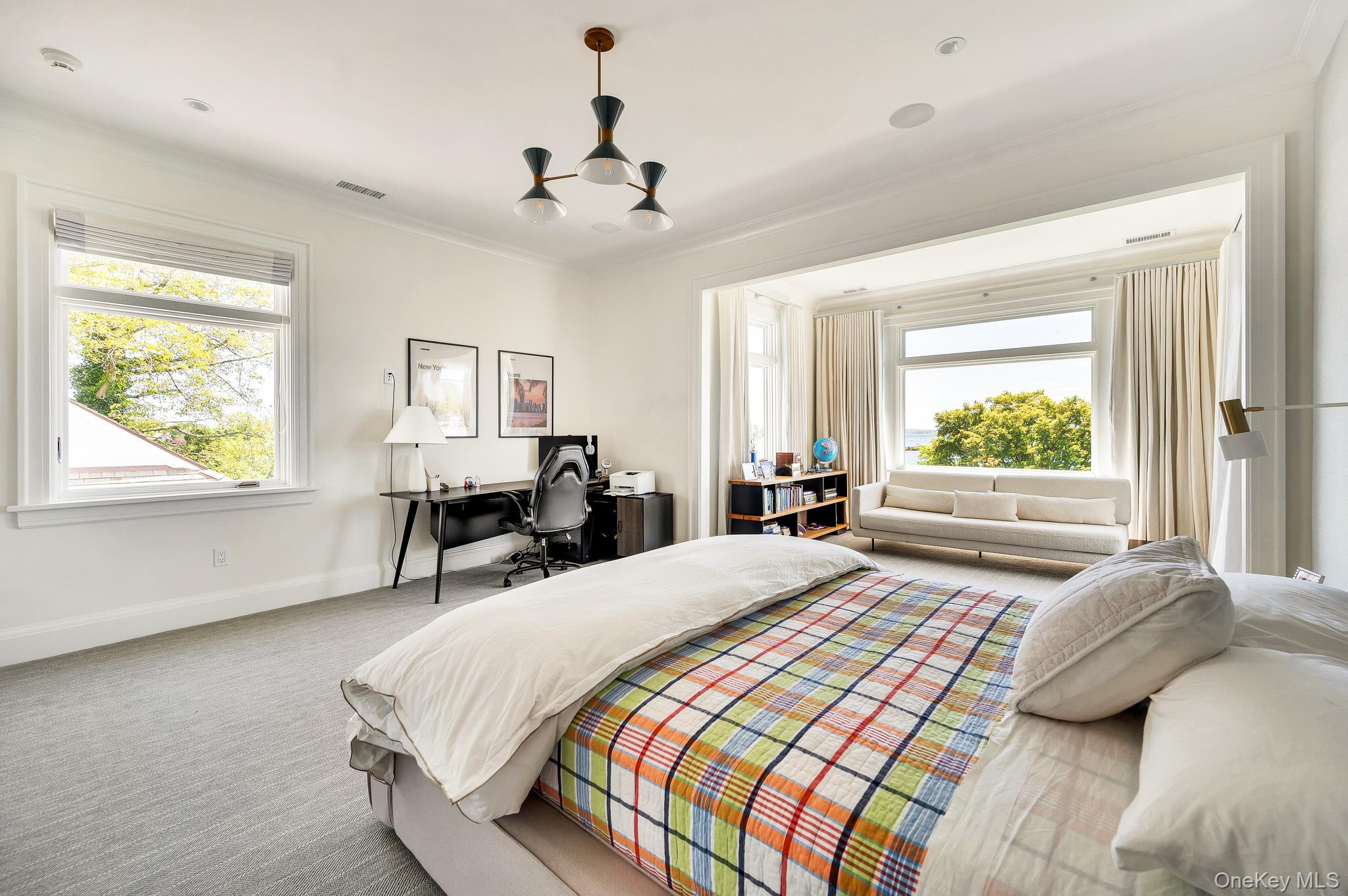 217 Hommocks Road Larchmont, NY 10538 - Photo 22 of 49 a bedroom with a large bed and a window