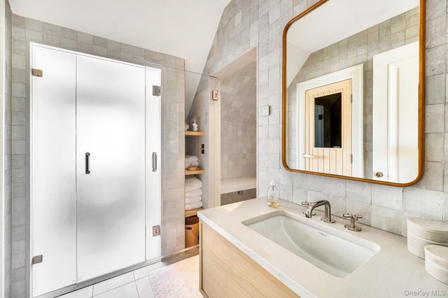 a bathroom with a sink and a mirror