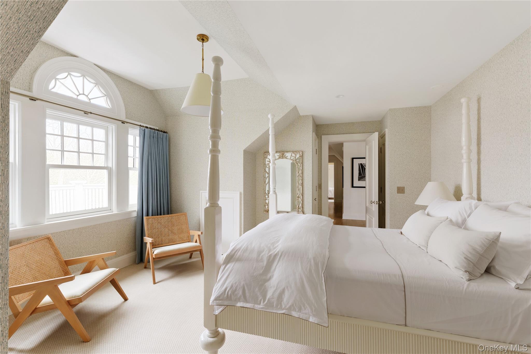 217 Hommocks Road Larchmont, NY 10538 - Photo 27 of 49 a bedroom with a bed and a chair