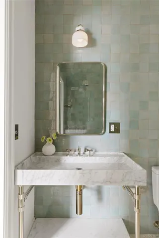 a bathroom with a sink and a mirror