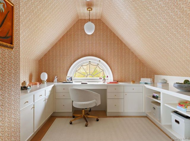 a kitchen with a sink a stove and cabinets