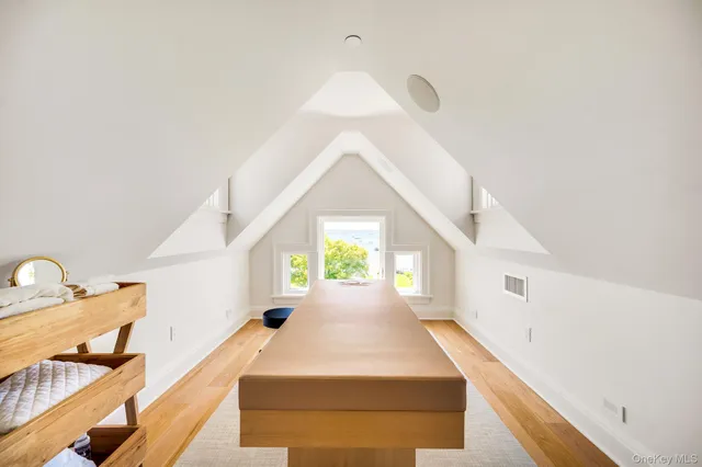 a en suite bathroom with a granite countertop sink