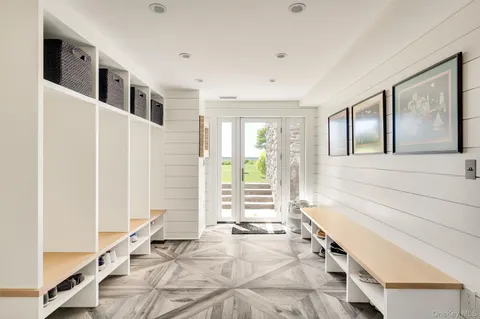 a spacious bathroom with a tub and large windows