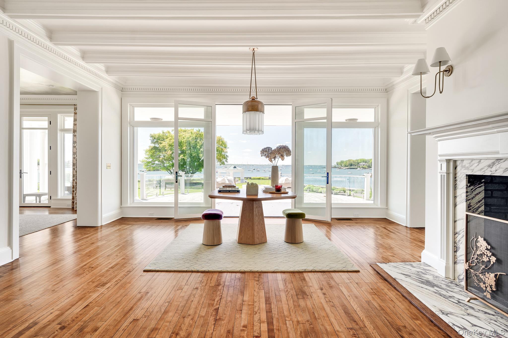 217 Hommocks Road Larchmont, NY 10538 - Photo 4 of 49 a living room with furniture large window and wooden floor