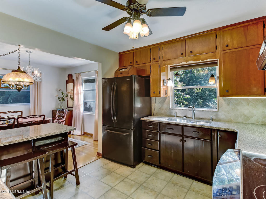 1321 Morgana Road Jacksonville, FL 32211 - Photo 14 of 44 a kitchen with stainless steel appliances a stove refrigerator and microwave