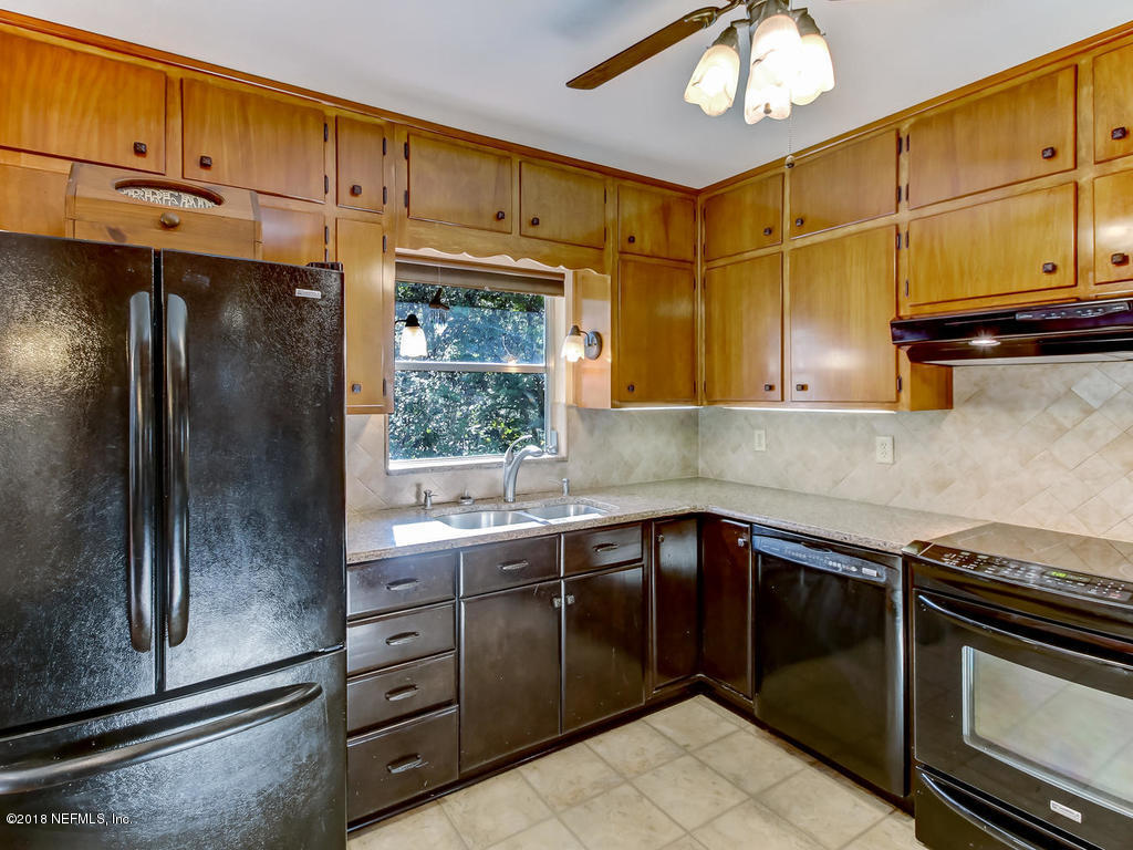1321 Morgana Road Jacksonville, FL 32211 - Photo 16 of 44 a kitchen with stainless steel appliances granite countertop a sink and cabinets