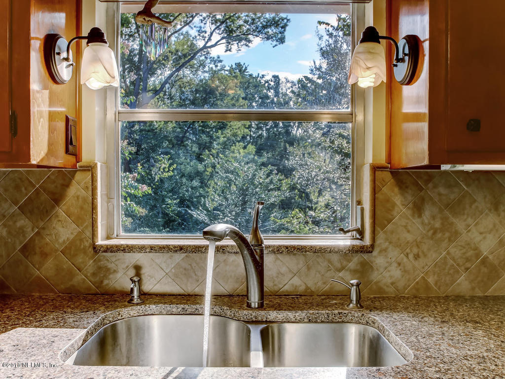 1321 Morgana Road Jacksonville, FL 32211 - Photo 17 of 44 a kitchen with a sink and large window