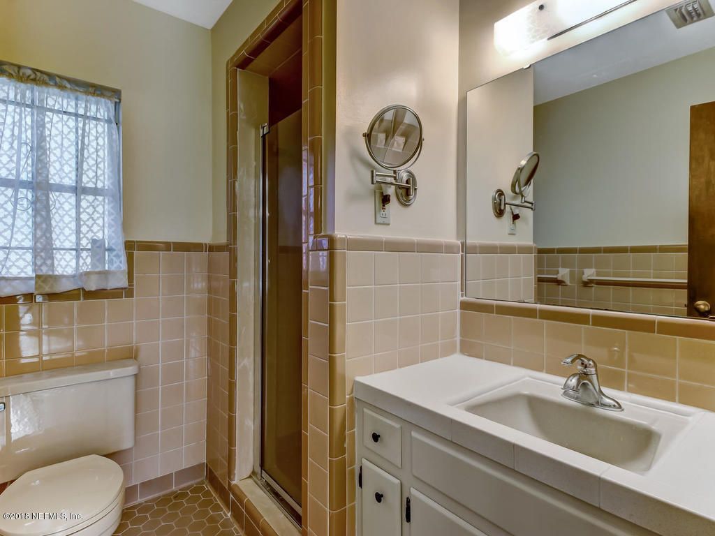 1321 Morgana Road Jacksonville, FL 32211 - Photo 22 of 44 a bathroom with a sink a toilet and shower