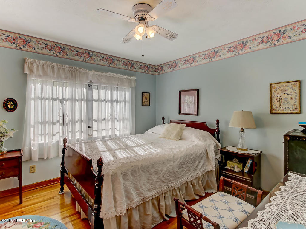 1321 Morgana Road Jacksonville, FL 32211 - Photo 25 of 44 a bedroom with a bed and a chandelier