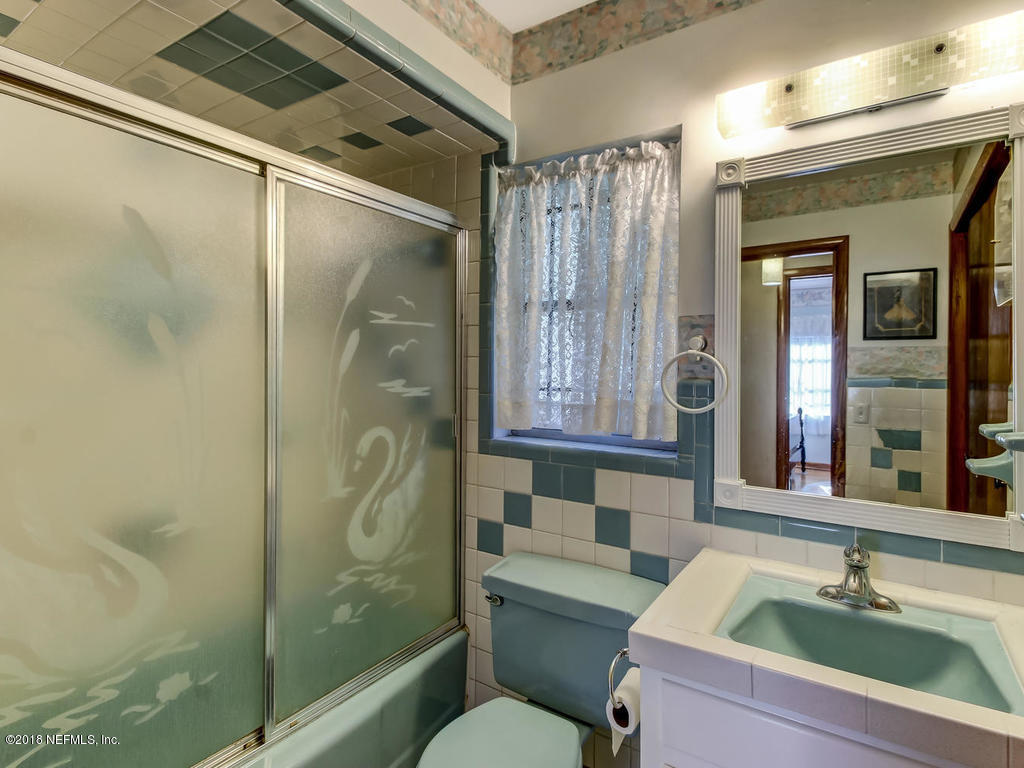 1321 Morgana Road Jacksonville, FL 32211 - Photo 27 of 44 a bathroom with a sink and a mirror