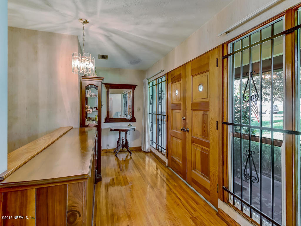1321 Morgana Road Jacksonville, FL 32211 - Photo 7 of 44 a view of a hallway with furniture and floor to ceiling window