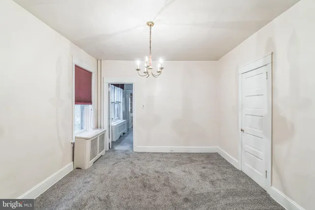 a view of a room with a flat screen tv