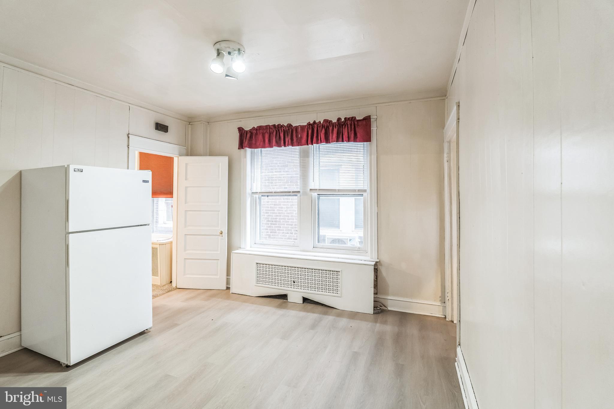 415 Rector Street Philadelphia, PA 19128 - Photo 12 of 31 a view of an empty room with a window