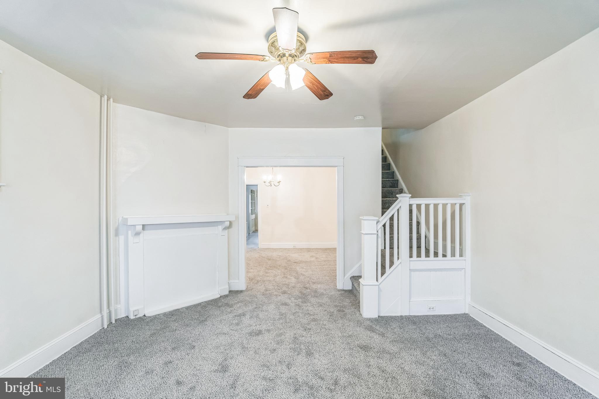 415 Rector Street Philadelphia, PA 19128 - Photo 8 of 31 an empty room with windows and fan