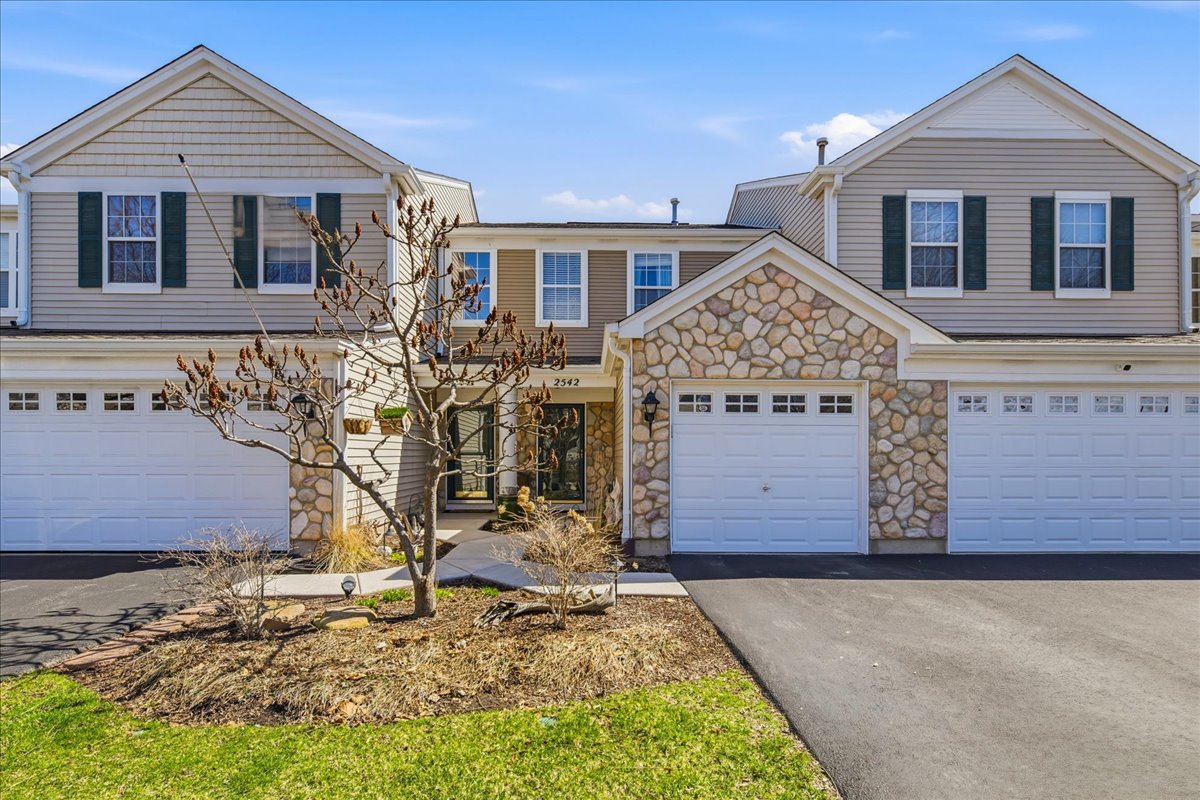 2542 Oak Tree Lane Plainfield, IL 60586 - Photo 1 of 20 a front view of a house with a yard