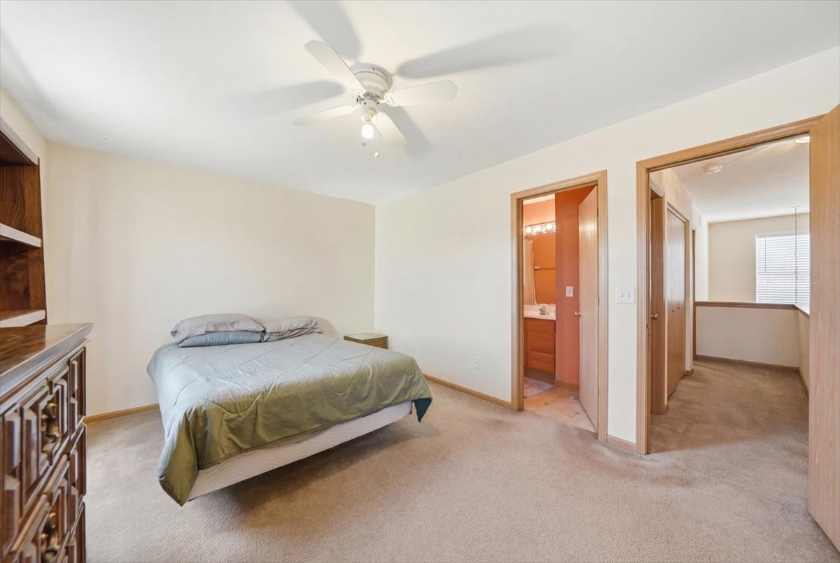 2542 Oak Tree Lane Plainfield, IL 60586 - Photo 13 of 20 a bedroom with a bed and ceiling fan