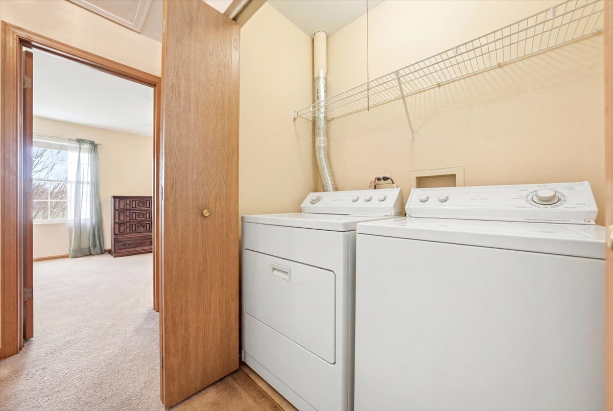 2542 Oak Tree Lane Plainfield, IL 60586 - Photo 16 of 20 a utility room with dryer and washer