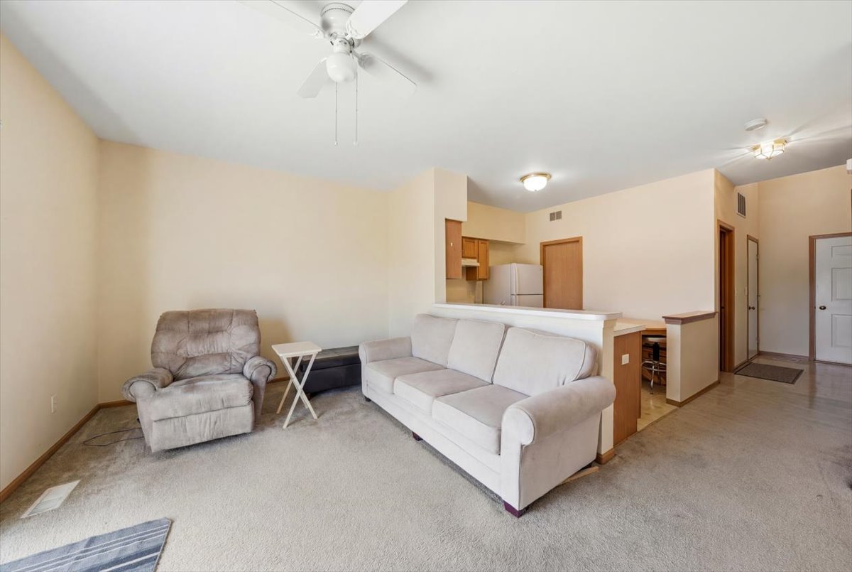 2542 Oak Tree Lane Plainfield, IL 60586 - Photo 6 of 20 a living room with furniture and a couch