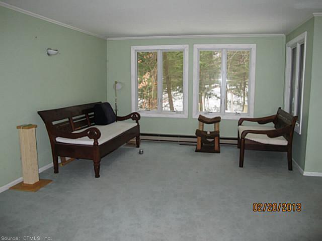 479 Evergreen Road, Unit 479 Torrington, CT 06790 - Photo 1 of 1 Living Room. Very open with corner stone fireplace!