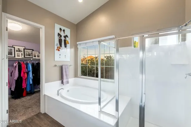 a bathroom with a tub and shower