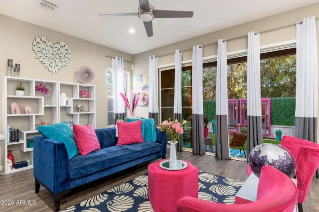 a living room with furniture and a potted plant