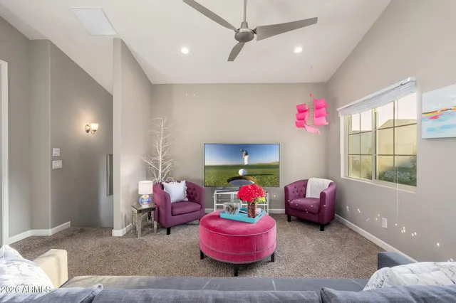 a bedroom with furniture and a window