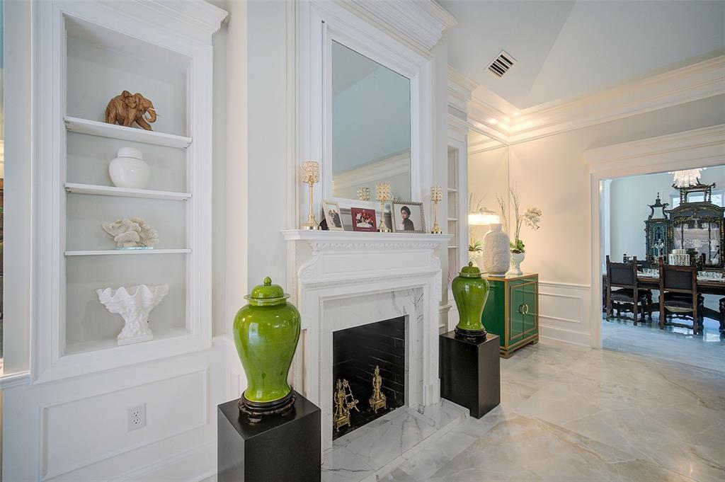 75 Osprey Point Drive Osprey, FL 34229 - Photo 16 of 92 a living room with furniture and a fireplace
