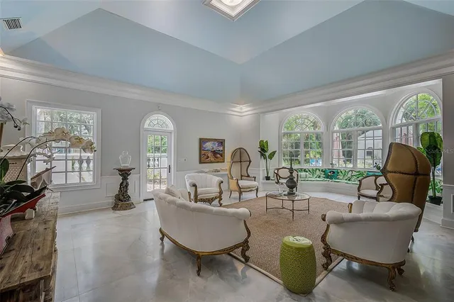 a bedroom with furniture and a flat screen tv