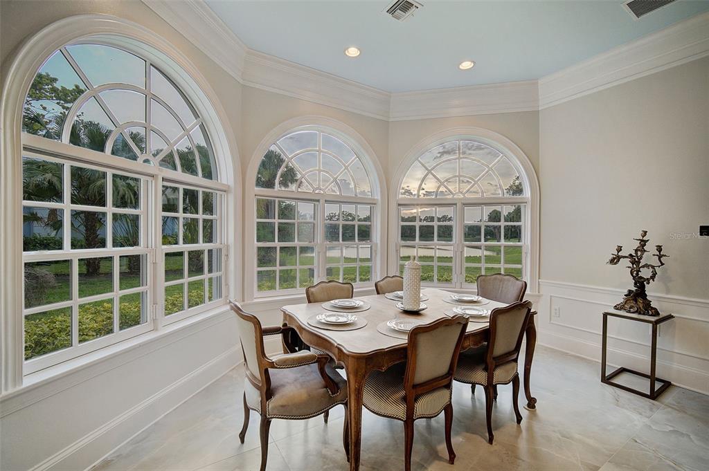 75 Osprey Point Drive Osprey, FL 34229 - Photo 30 of 92 a view of a dining room with furniture window and outside view