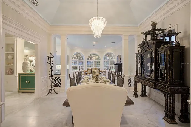 a bedroom with a large bed and a large window