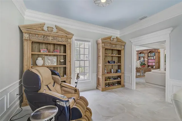 a kitchen with granite countertop white cabinets and sink