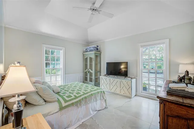 a front view of a house with a yard and a garden