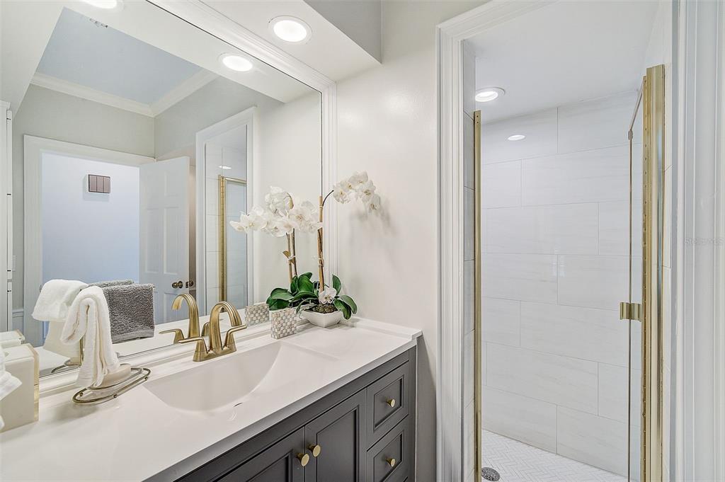 75 Osprey Point Drive Osprey, FL 34229 - Photo 42 of 92 a bathroom with a sink and a mirror