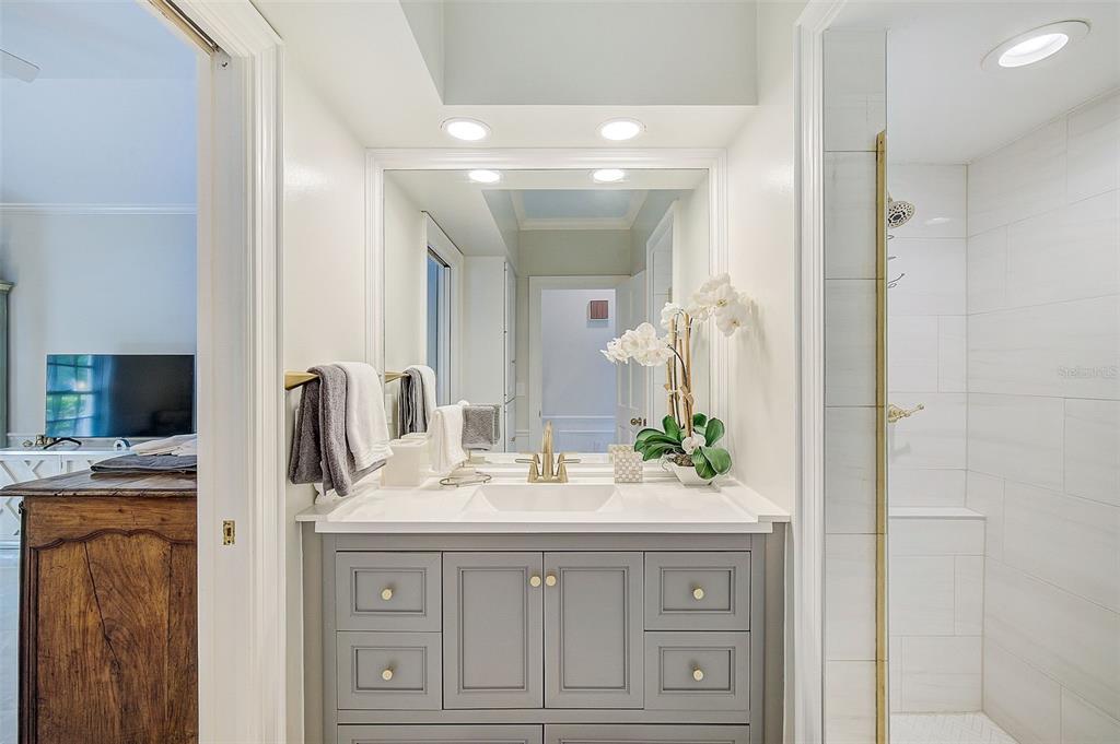 75 Osprey Point Drive Osprey, FL 34229 - Photo 43 of 92 a bathroom with a sink vanity and a mirror