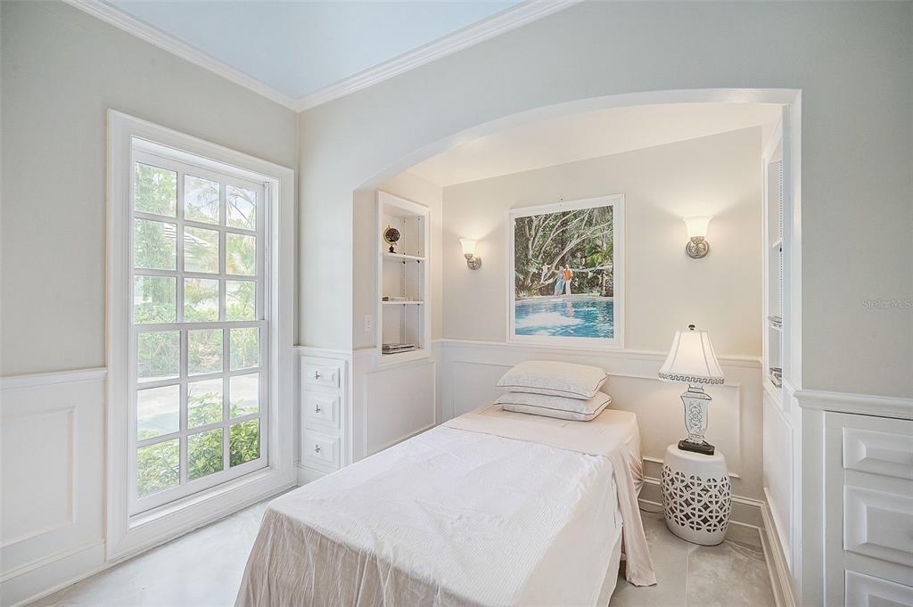 75 Osprey Point Drive Osprey, FL 34229 - Photo 45 of 92 a bedroom with a bed and a window