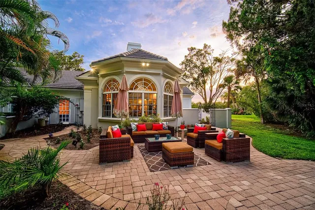 a view of a house with swimming pool and a yard