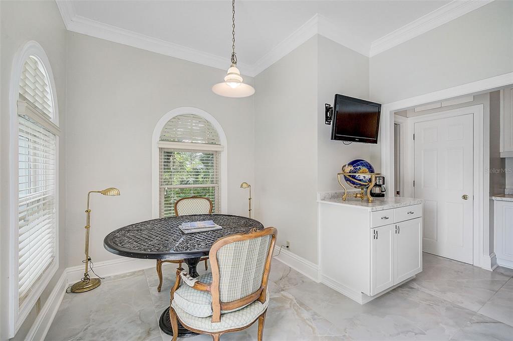 75 Osprey Point Drive Osprey, FL 34229 - Photo 55 of 92 a kitchen with a stove a sink and a refrigerator