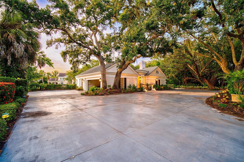 75 Osprey Point Drive Osprey, FL 34229 - Photo 64 of 92 a view of house with outdoor space and trees