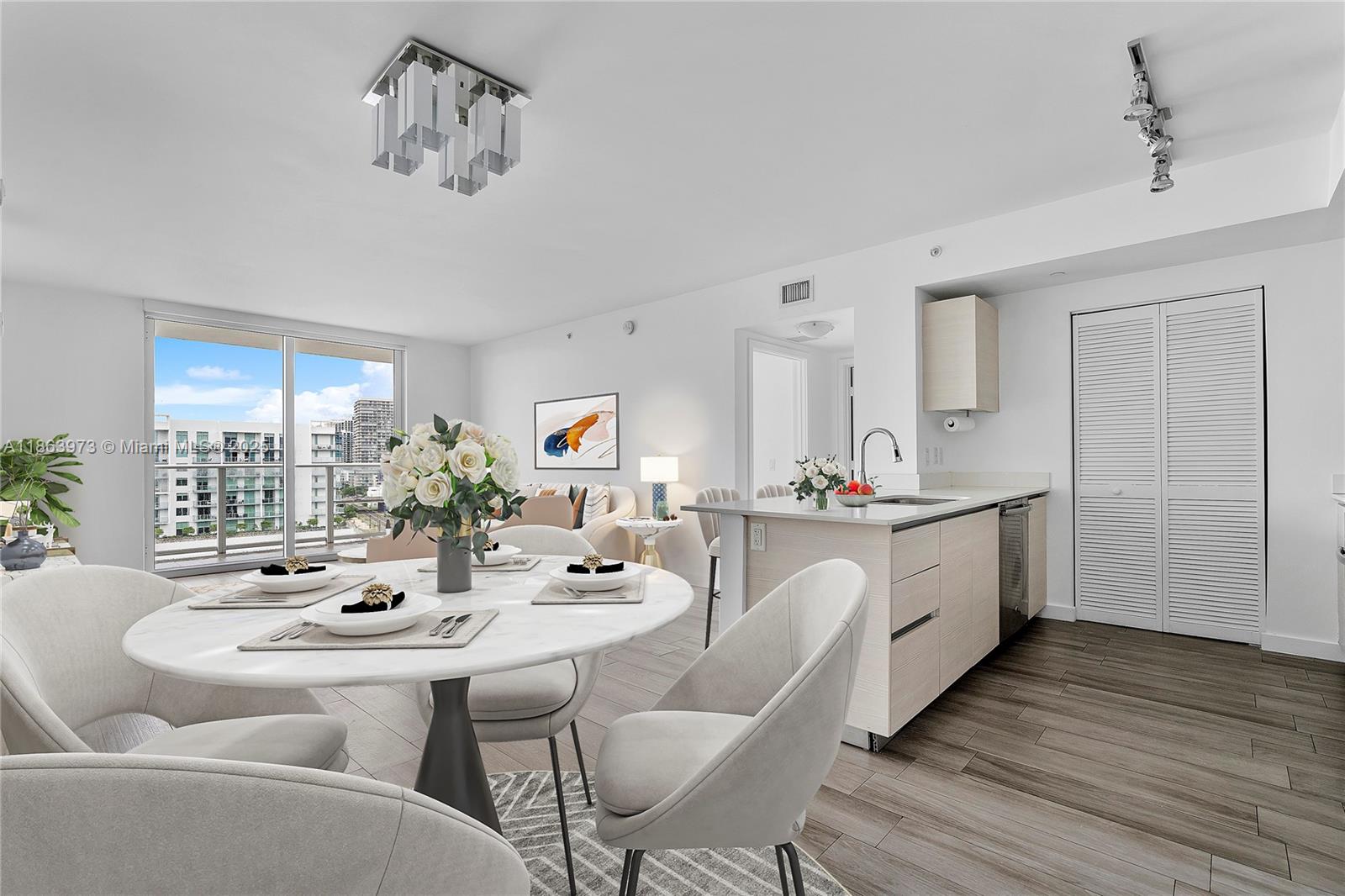 4250 Biscayne Boulevard, Unit 1416 Miami, FL 33137 - Photo 3 of 55 a large white kitchen with a large window