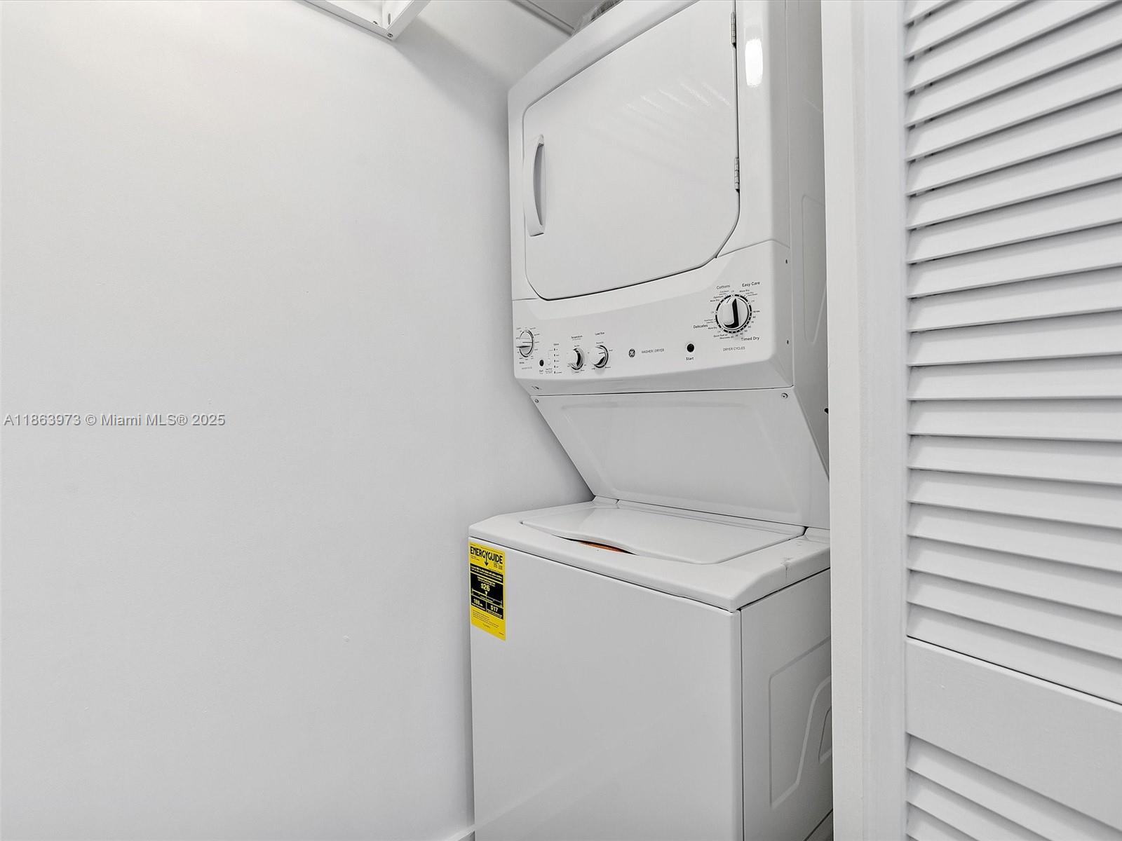 4250 Biscayne Boulevard, Unit 1416 Miami, FL 33137 - Photo 36 of 55 a utility room with dryer and washer