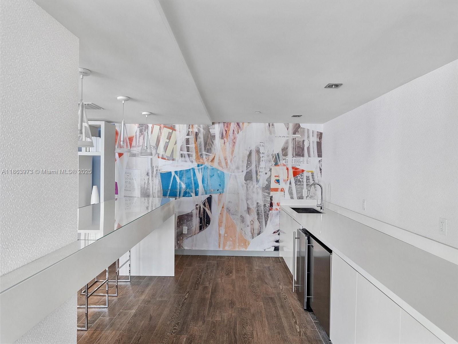 4250 Biscayne Boulevard, Unit 1416 Miami, FL 33137 - Photo 37 of 55 a view of a room with guitars and wooden floor