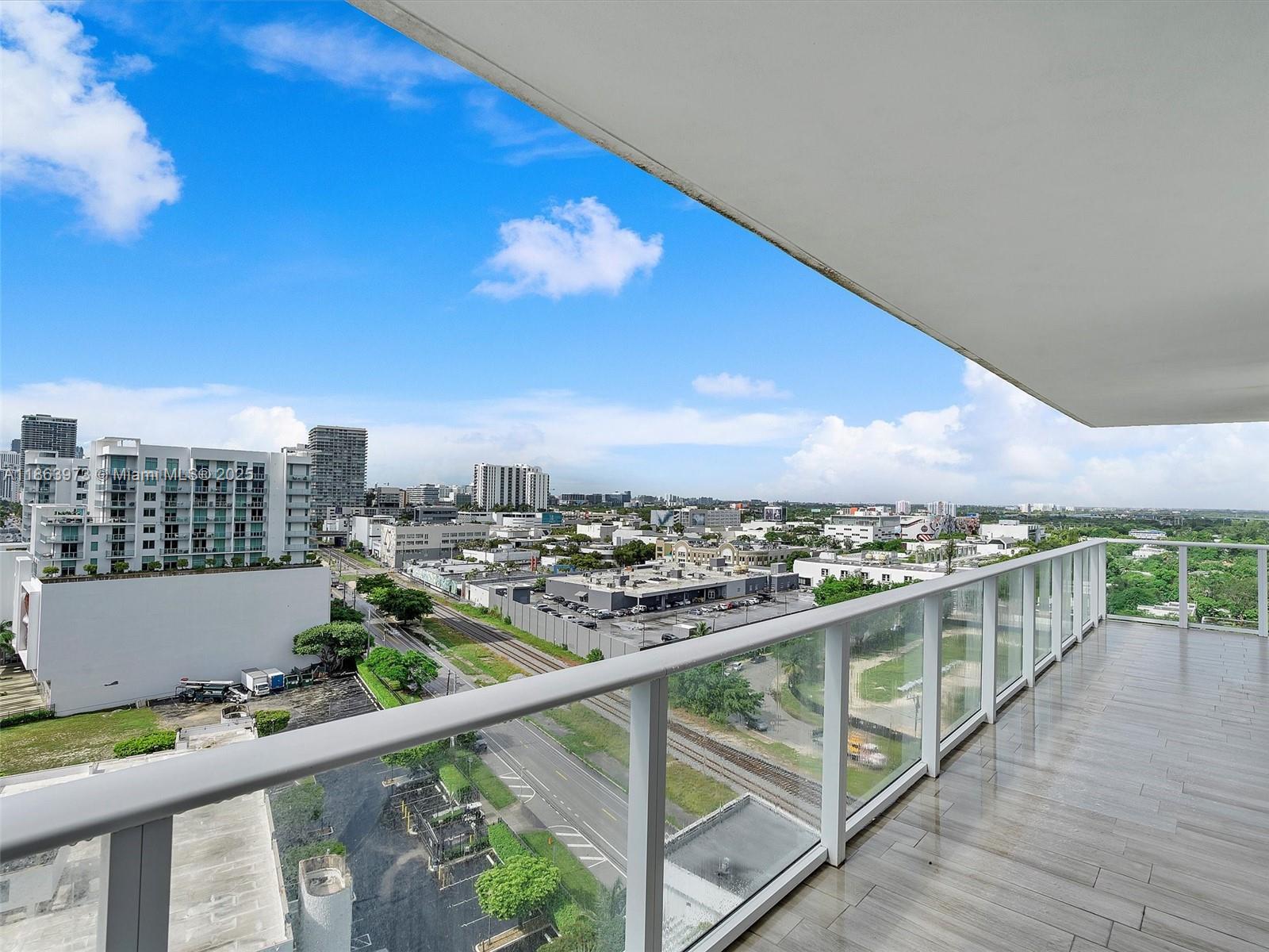 4250 Biscayne Boulevard, Unit 1416 Miami, FL 33137 - Photo 53 of 55 a view of a city skyline from a balcony