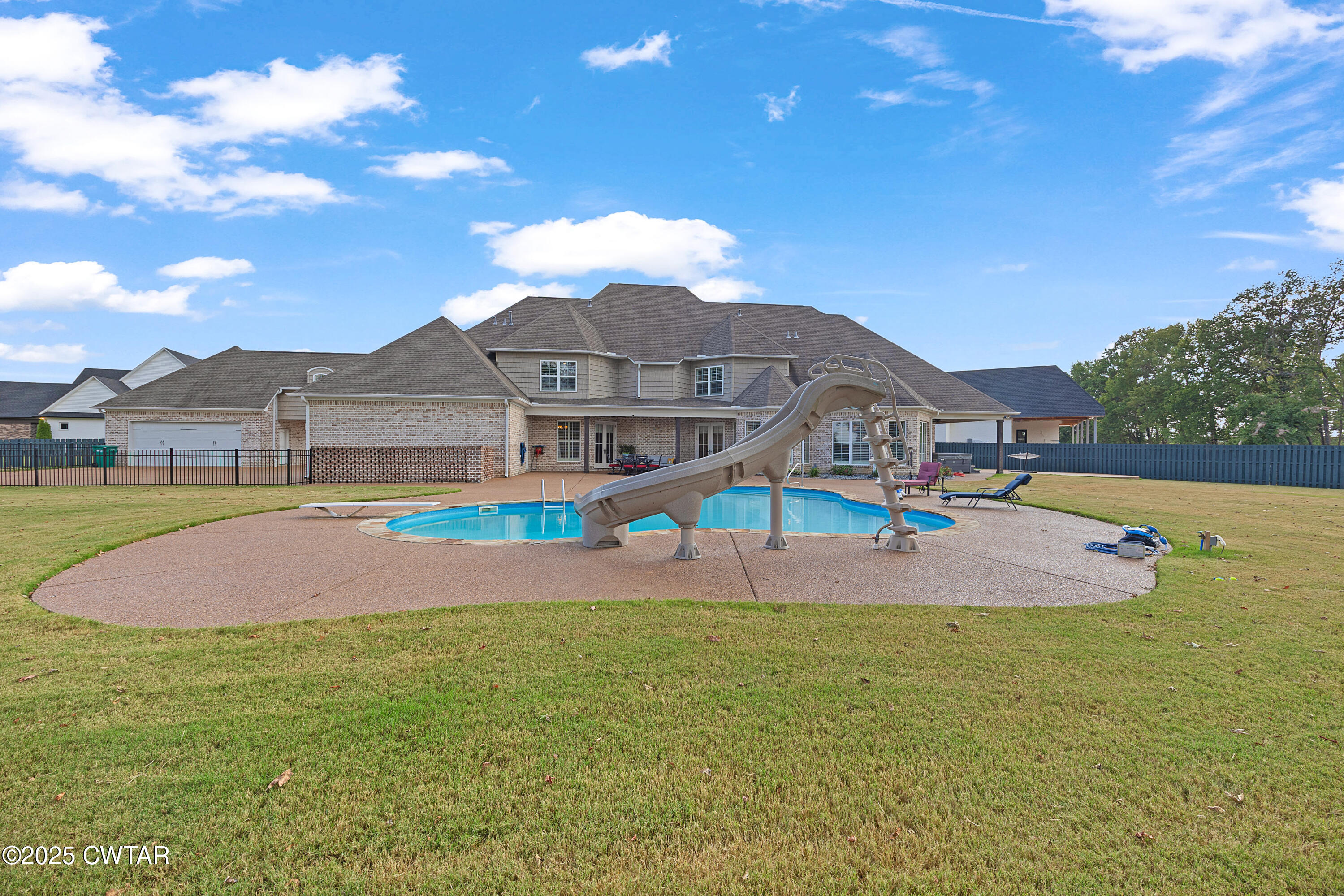 61 Rochester Cove Jackson, TN 38305 - Photo 11 of 55 a view of a white house with a yard and sitting area