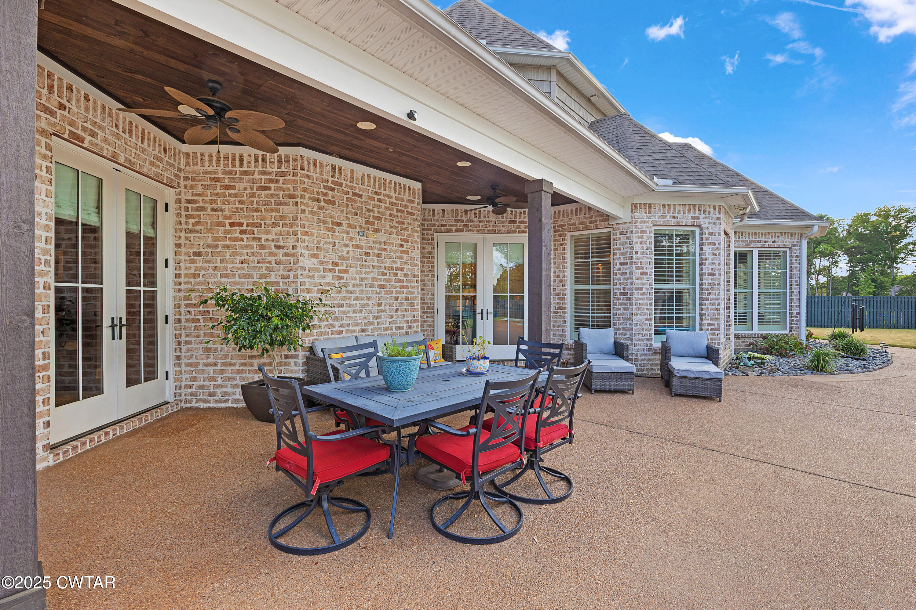 61 Rochester Cove Jackson, TN 38305 - Photo 14 of 55 a roof deck with table and chairs and potted plants