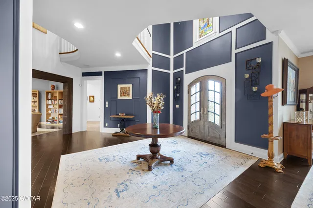 a kitchen with kitchen island granite countertop a sink and a stove