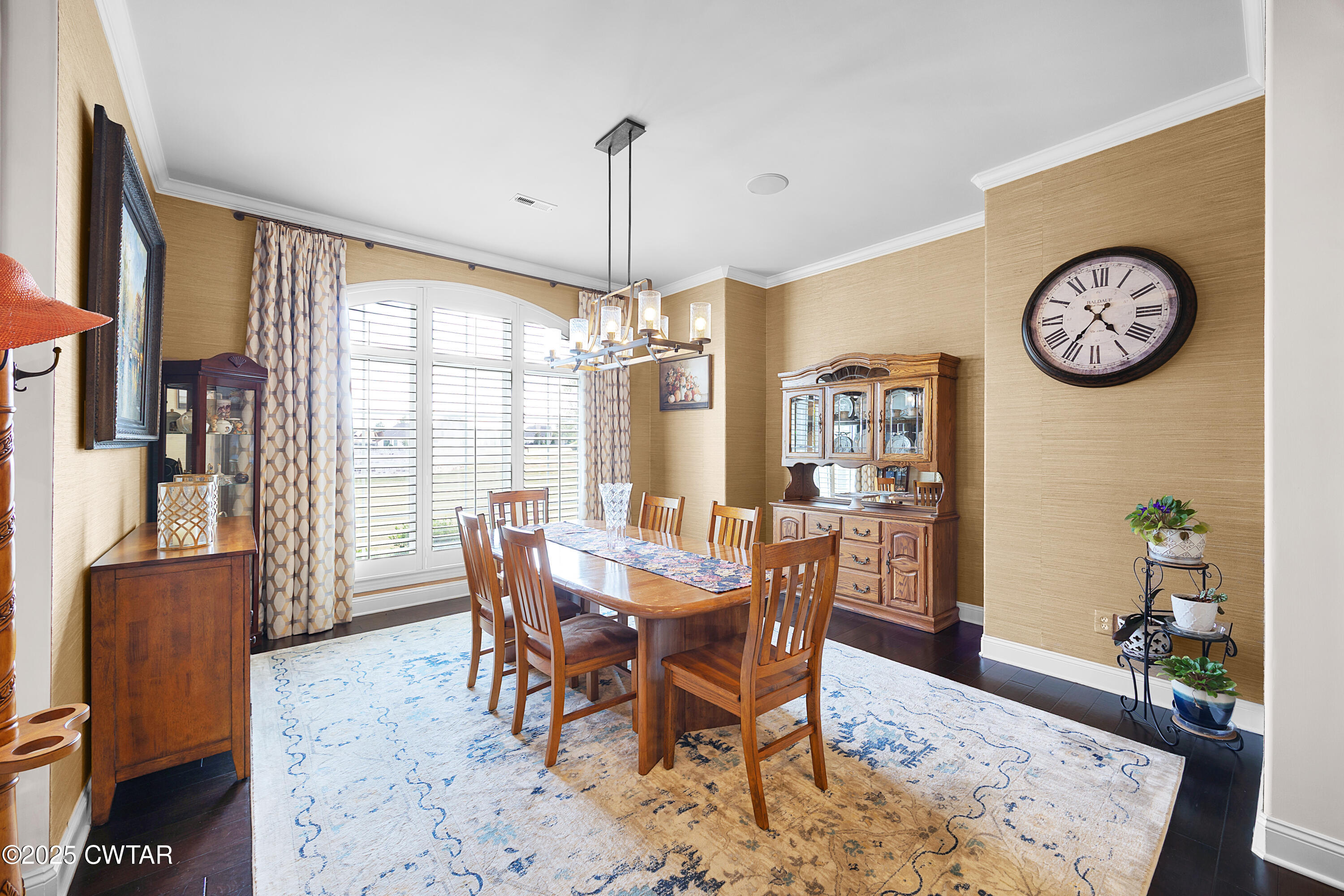 61 Rochester Cove Jackson, TN 38305 - Photo 17 of 55 a view of a dining room and livingroom with furniture wooden floor and a rug